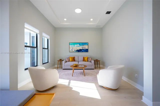 a dining room with wooden floor and a table