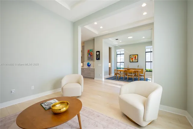 a kitchen with stainless steel appliances kitchen island granite countertop a refrigerator and a sink