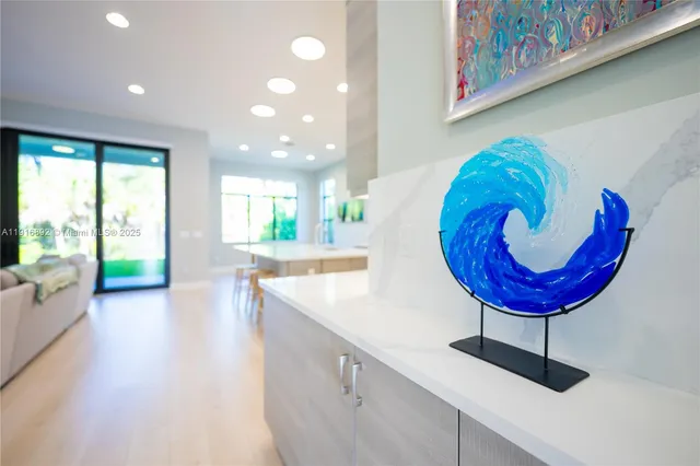 a kitchen with stainless steel appliances kitchen island granite countertop a sink and cabinets