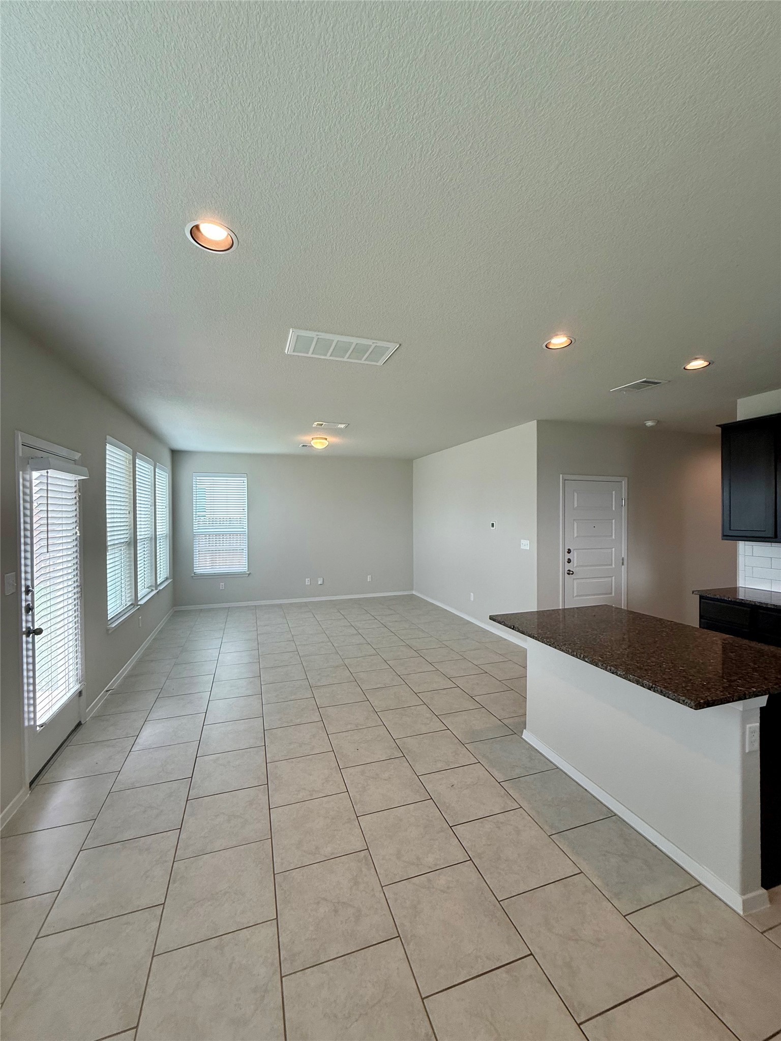 212 Lake Placid Run Elgin, TX 78621 - Photo 8 of 27 Bright and inviting, this open-concept area features elegant tile flooring and abundant natural illumination.