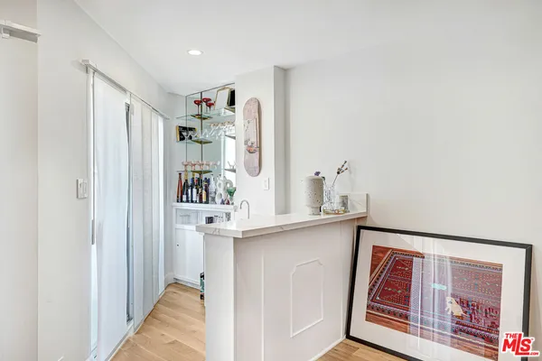 a view of kitchen with furniture and wooden floor