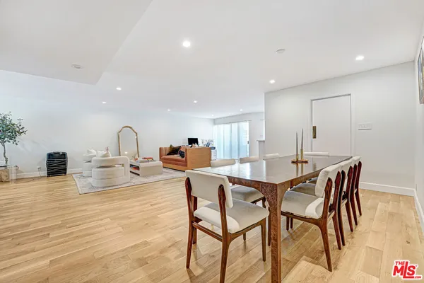 a view of a dining room with furniture and a fireplace
