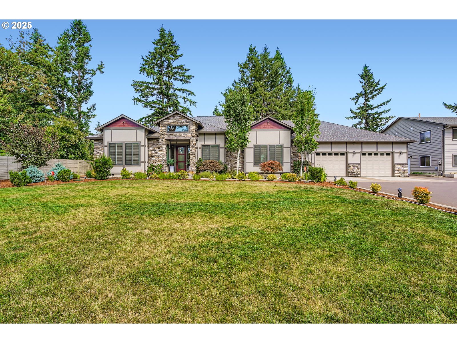 14880 Southeast Anderson Road Damascus, OR 97089 - Photo 1 of 45 a front view of a house with a garden