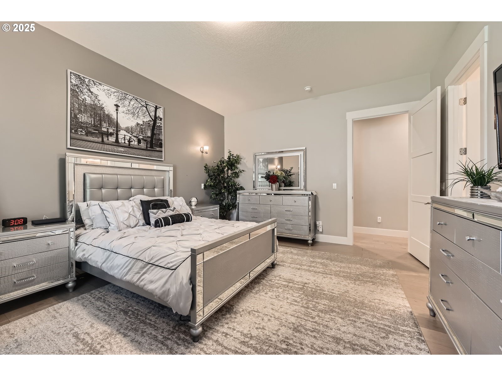 14880 Southeast Anderson Road Damascus, OR 97089 - Photo 24 of 45 a bedroom with a large bed and a chandelier