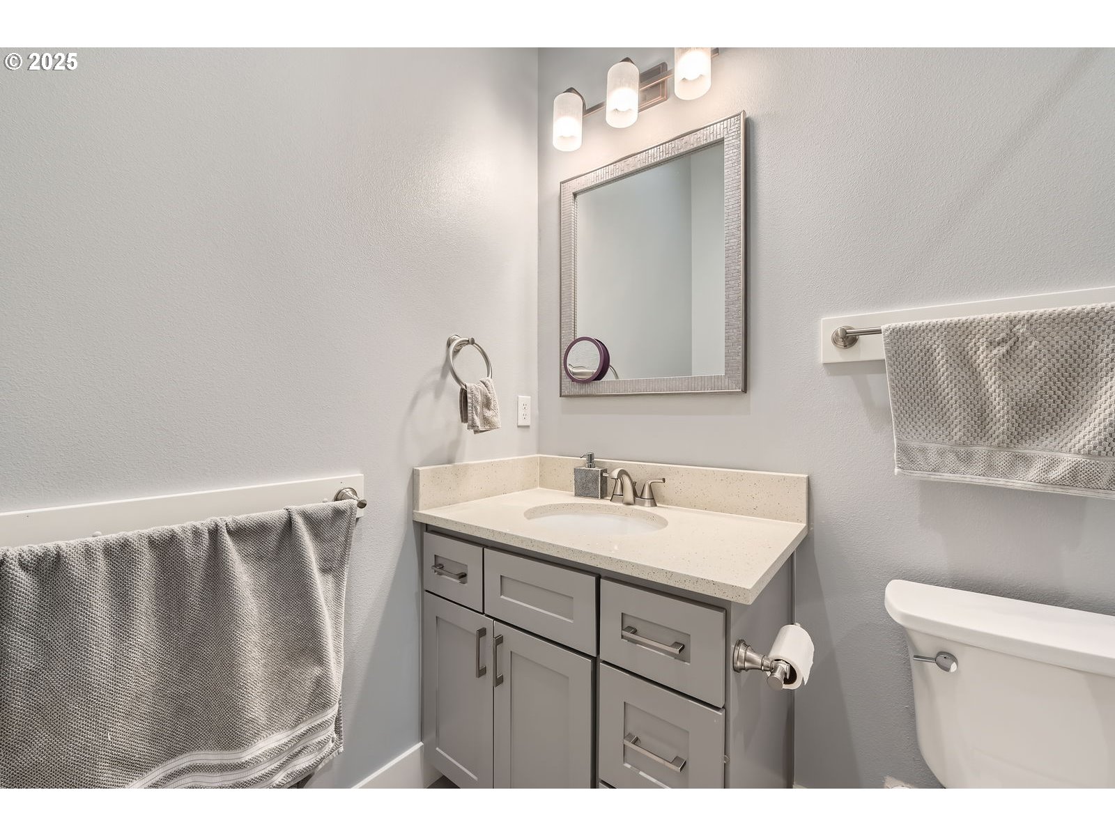 14880 Southeast Anderson Road Damascus, OR 97089 - Photo 26 of 45 a bathroom with a sink vanity and a mirror