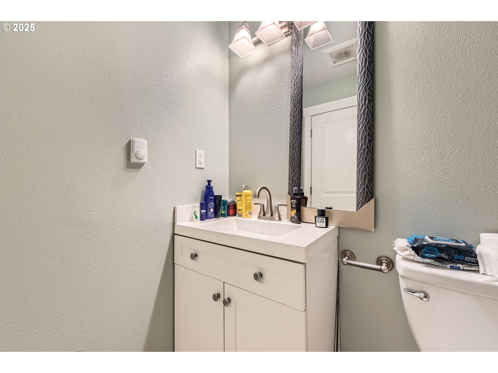14880 Southeast Anderson Road Damascus, OR 97089 - Photo 27 of 45 a bathroom with a sink and a mirror