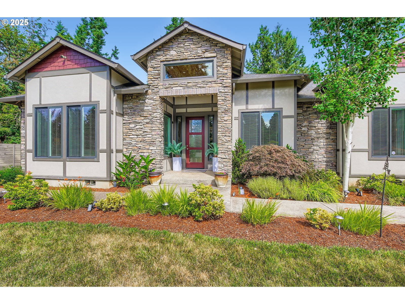 14880 Southeast Anderson Road Damascus, OR 97089 - Photo 3 of 45 a front view of a house with a yard and potted plants