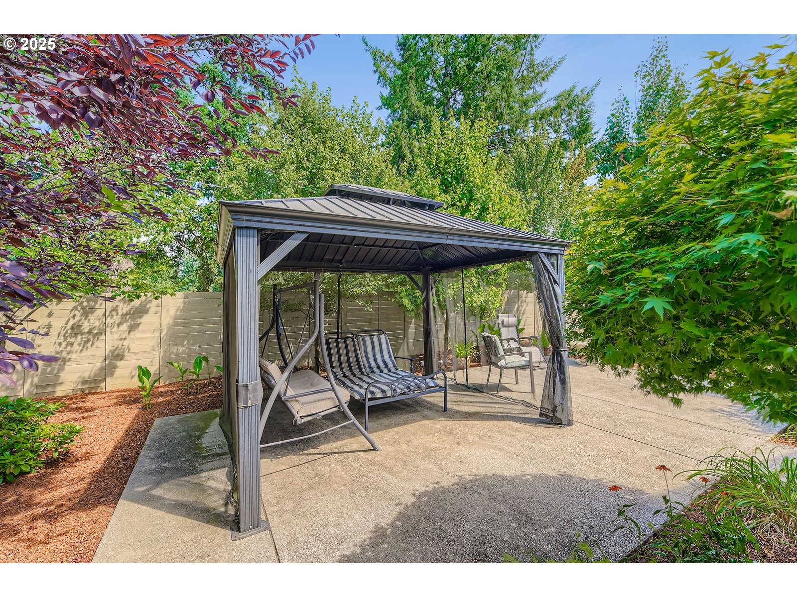14880 Southeast Anderson Road Damascus, OR 97089 - Photo 34 of 45 a backyard of a house with swing table and chairs