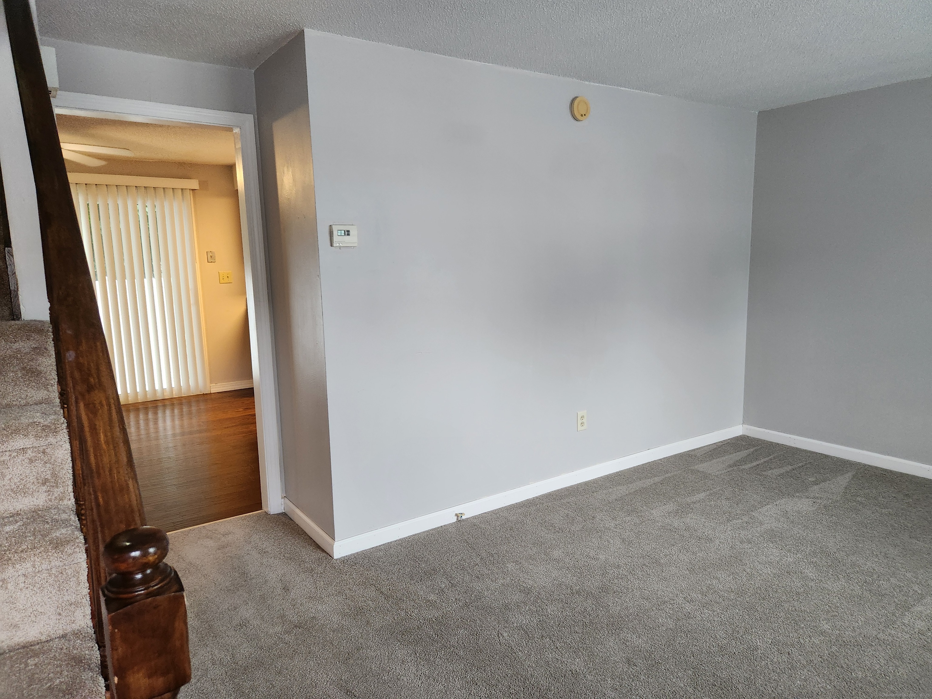 617 Center Street, Unit D Manchester, CT 06040 - Photo 5 of 18 an empty room with windows