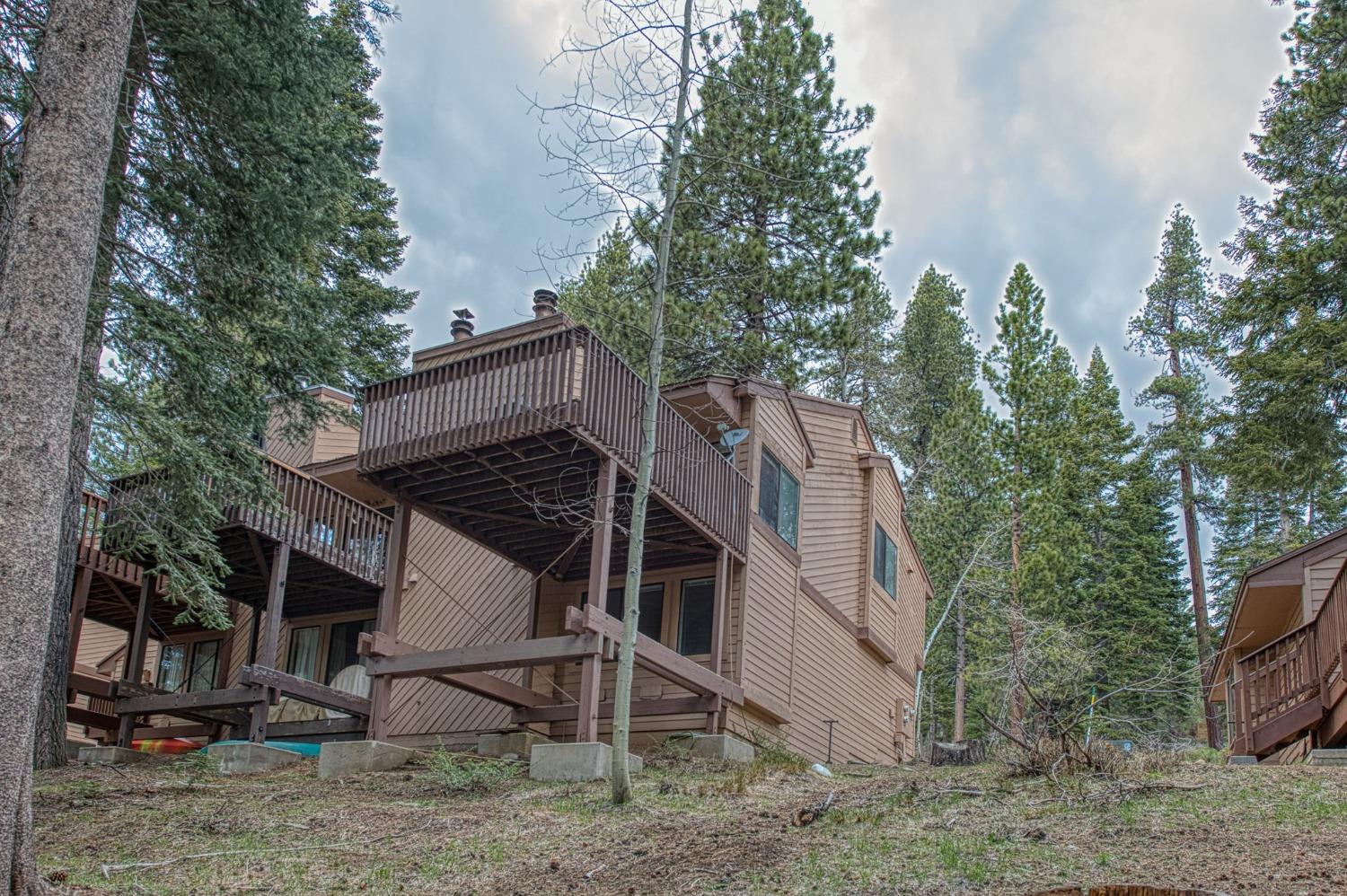 62721 Huntington Vista Road, Unit 119 Mono Hot Springs, CA 93642 - Photo 16 of 27 a view of a house with a yard