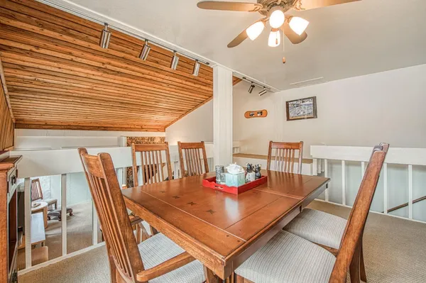 a dining room with furniture and window