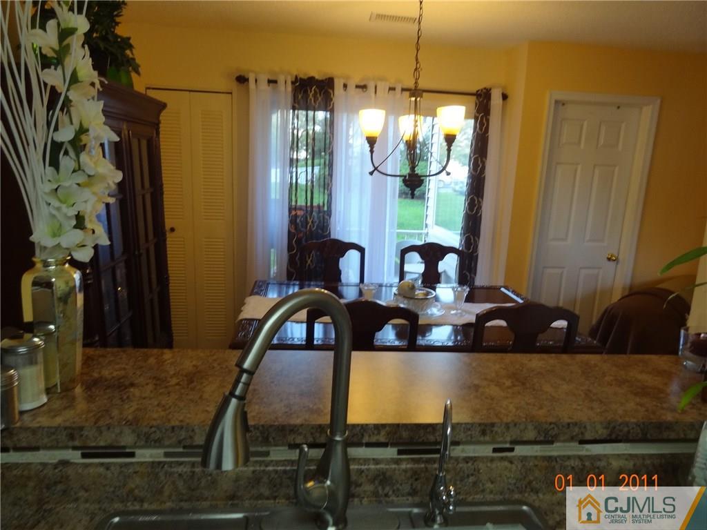 1019 Edpas Road, Unit 1019 New Brunswick, NJ 08901 - Photo 11 of 18 a view of a dining room with furniture