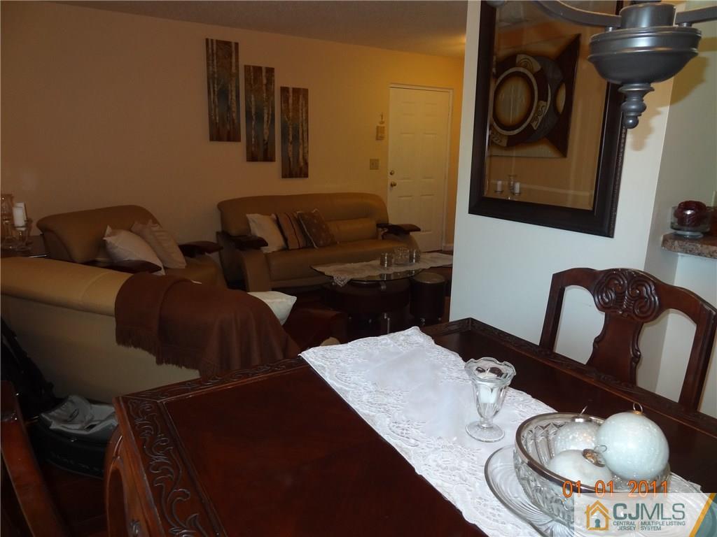 1019 Edpas Road, Unit 1019 New Brunswick, NJ 08901 - Photo 12 of 18 a living room with furniture and rug