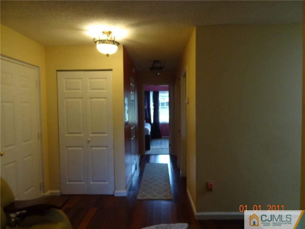 1019 Edpas Road, Unit 1019 New Brunswick, NJ 08901 - Photo 16 of 18 a view of a hallway with a room