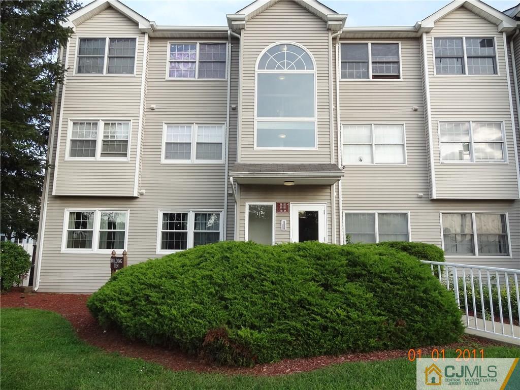 1019 Edpas Road, Unit 1019 New Brunswick, NJ 08901 - Photo 18 of 18 a front view of a house with a garden