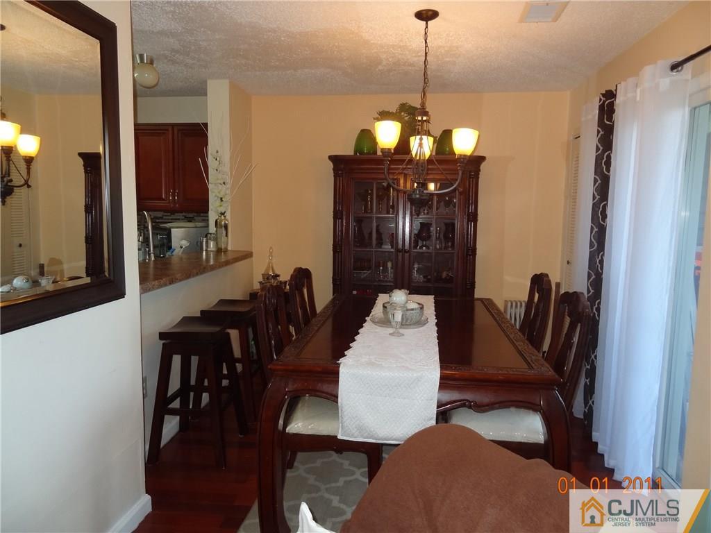 1019 Edpas Road, Unit 1019 New Brunswick, NJ 08901 - Photo 5 of 18 a view of a dining room with furniture
