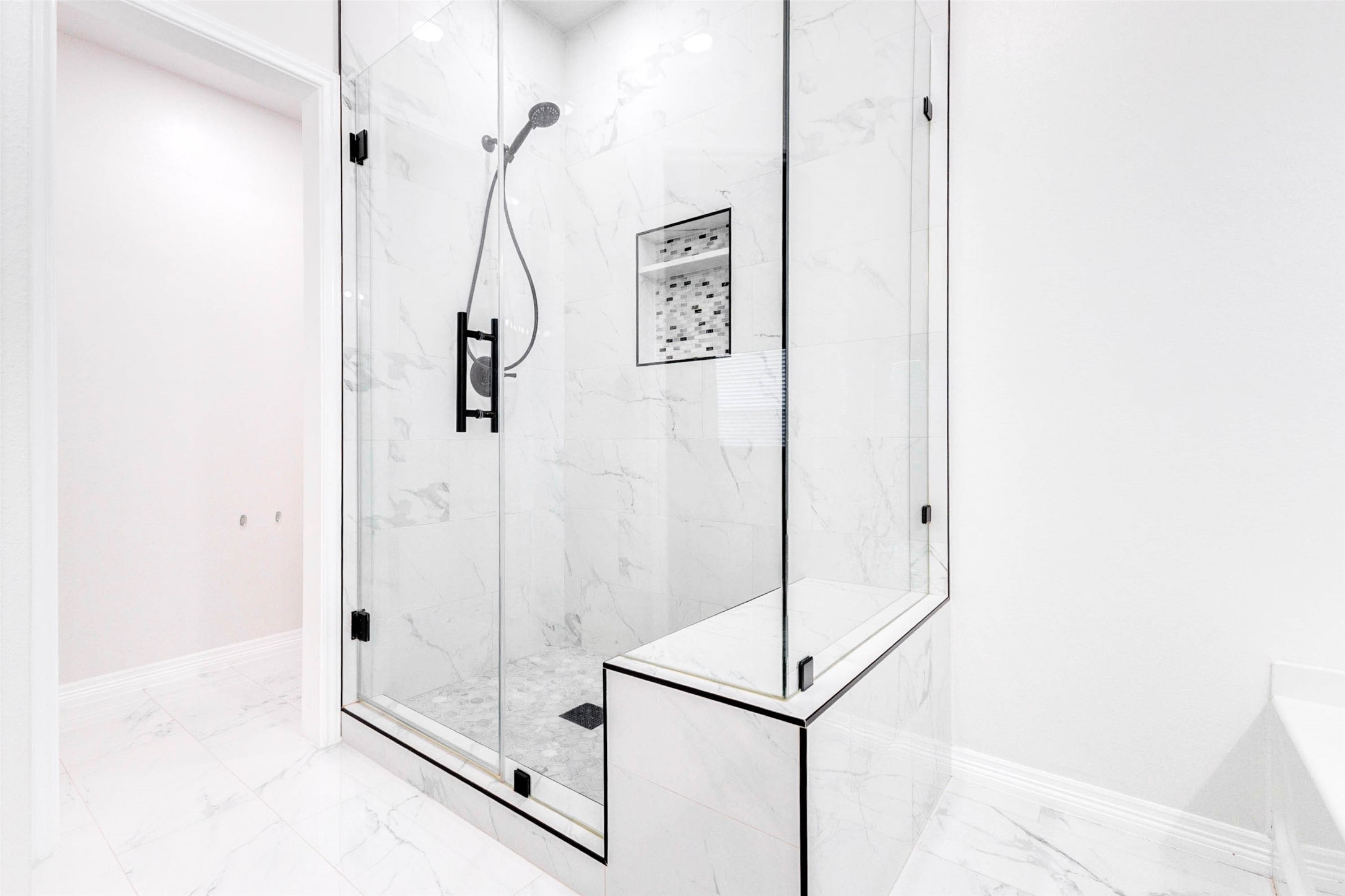 7039 Primrose Road Baytown, TX 77521 - Photo 18 of 25 Walk-in shower with glass enclosure and clean modern finishes