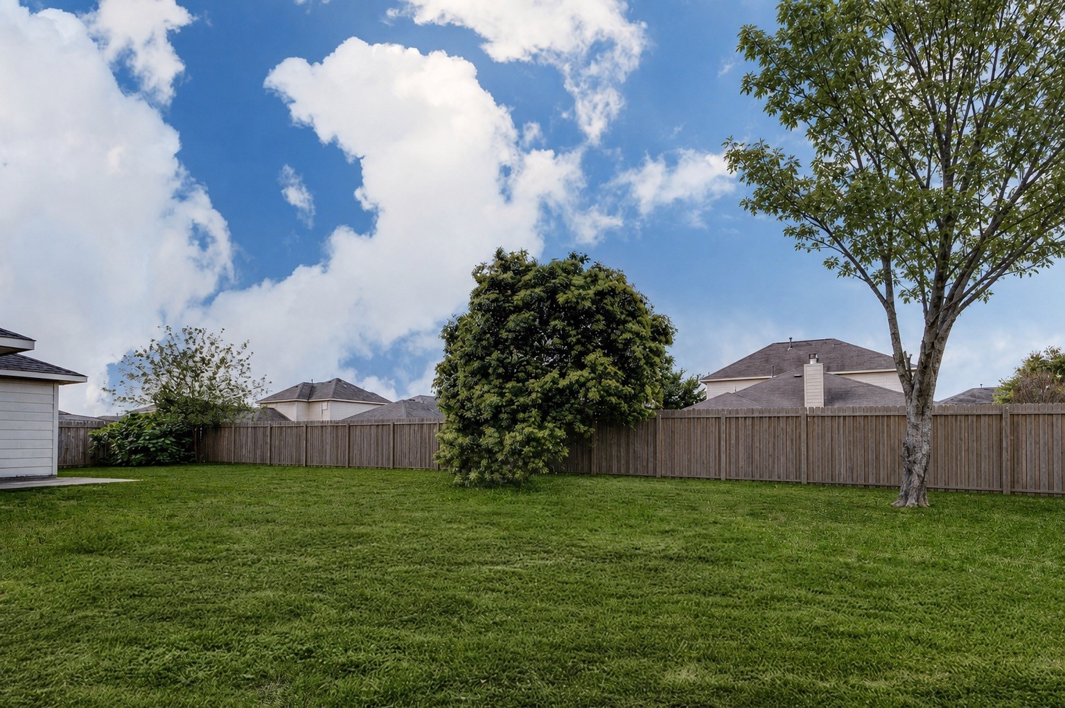 7039 Primrose Road Baytown, TX 77521 - Photo 25 of 25 Large backyard offering plenty of space for outdoor living and entertaining