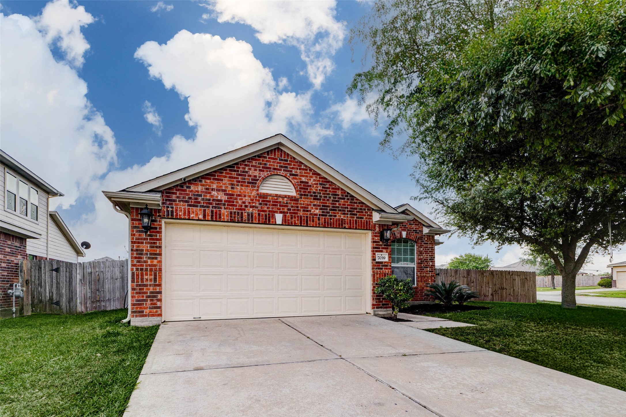 7039 Primrose Road Baytown, TX 77521 - Photo 3 of 25 Inviting front view with mature tree and clean landscaping