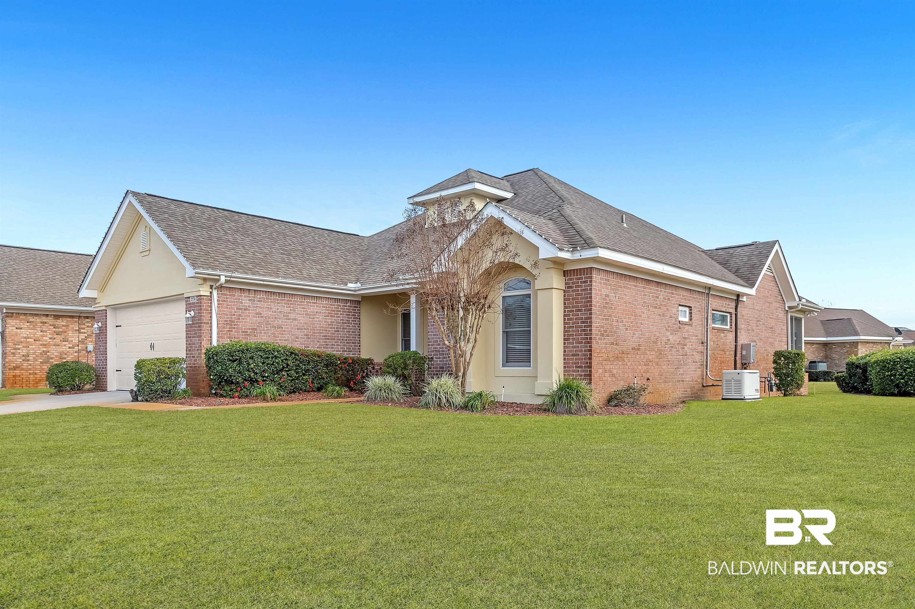 22726 Inverness Way Foley, AL 36535 - Photo 4 of 51 Ranch-style home featuring a front yard, a garage, and central air condition unit