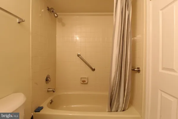 a bathroom with a shower and a toilet
