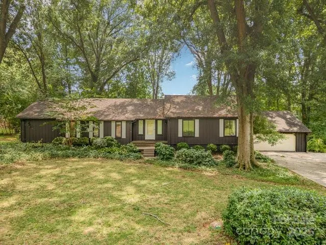 a view of a yard and mountain