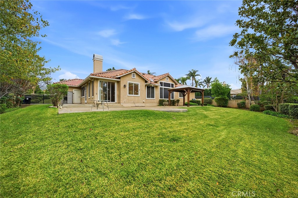 9379 Monarch Court Rancho Cucamonga, CA 91737 - Photo 15 of 19 a front view of a house with garden