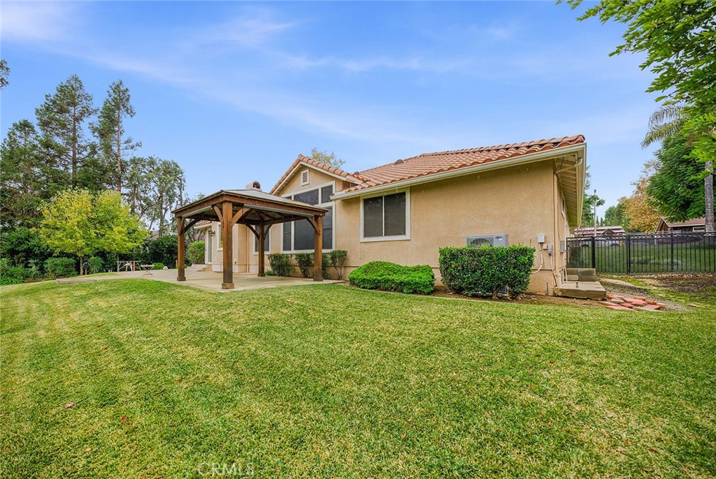 9379 Monarch Court Rancho Cucamonga, CA 91737 - Photo 16 of 19 a view of a house with a yard and sitting area