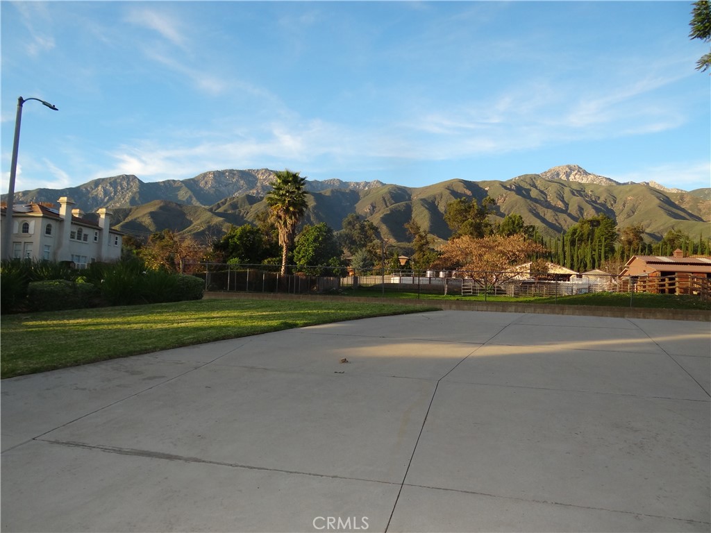 9379 Monarch Court Rancho Cucamonga, CA 91737 - Photo 19 of 19 a view of building with mountains in the background