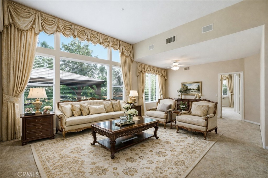 9379 Monarch Court Rancho Cucamonga, CA 91737 - Photo 2 of 19 a living room with furniture and a large window