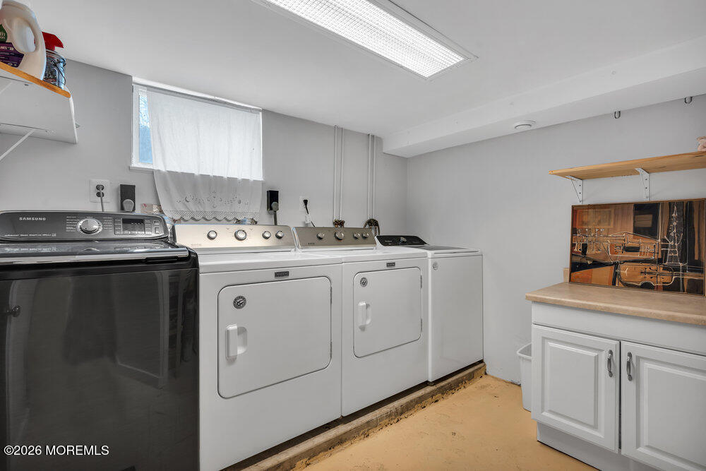 34 State Route Colts Neck, NJ 07722 - Photo 28 of 40 a utility room with cabinets washer and dryer