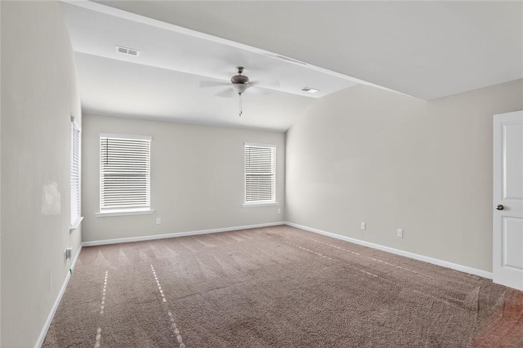 1553 Spring Hollow Way Stone Mountain, GA 30083 - Photo 12 of 25 a view of an empty room with a window