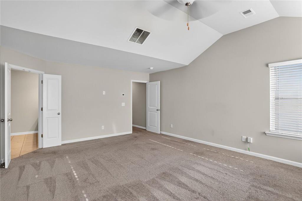 1553 Spring Hollow Way Stone Mountain, GA 30083 - Photo 14 of 25 a view of an empty room with a window