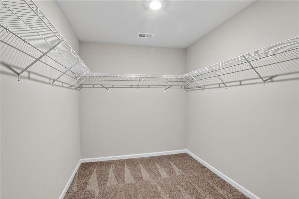 1553 Spring Hollow Way Stone Mountain, GA 30083 - Photo 17 of 25 a view of a room with racks on the wall