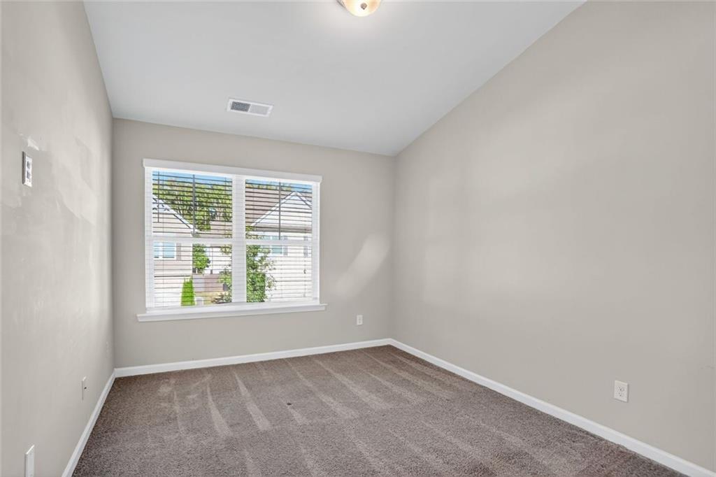 1553 Spring Hollow Way Stone Mountain, GA 30083 - Photo 19 of 25 an empty room with a window