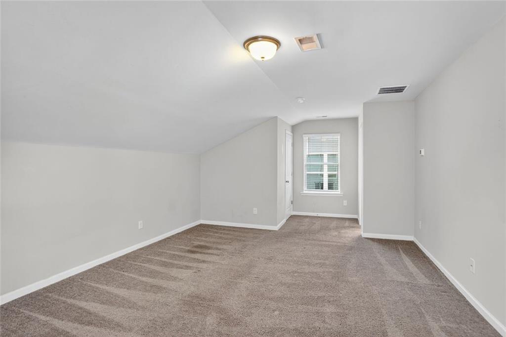 1553 Spring Hollow Way Stone Mountain, GA 30083 - Photo 22 of 25 a view of an empty room