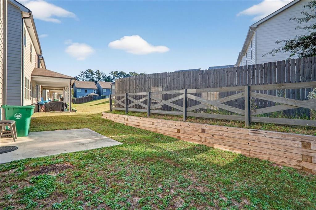 1553 Spring Hollow Way Stone Mountain, GA 30083 - Photo 25 of 25 a view of a backyard with wooden fence