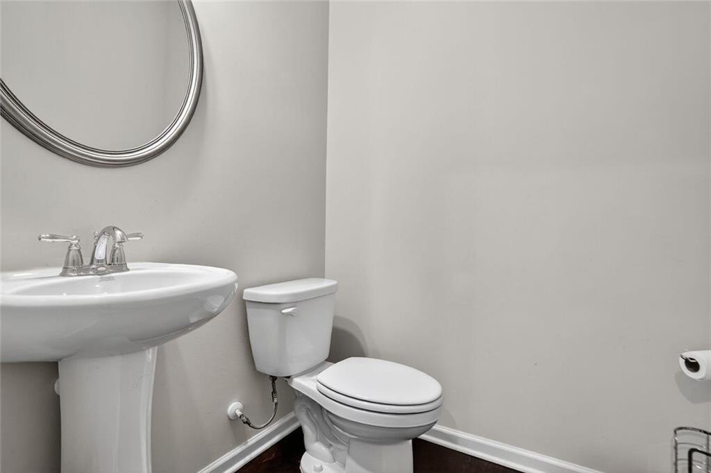 1553 Spring Hollow Way Stone Mountain, GA 30083 - Photo 10 of 25 a bathroom with a sink and a toilet