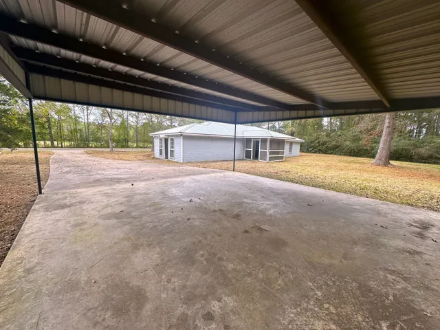 a view of an empty room with a patio