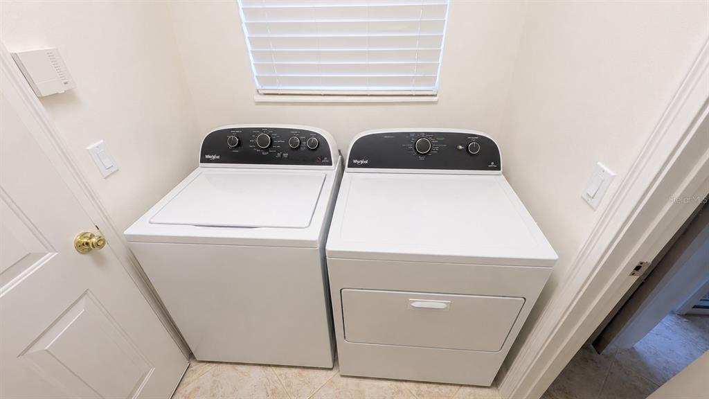 6552 Moorings Point Circle, Unit 102 Lakewood Ranch, FL 34202 - Photo 36 of 57 a utility room with dryer and washer