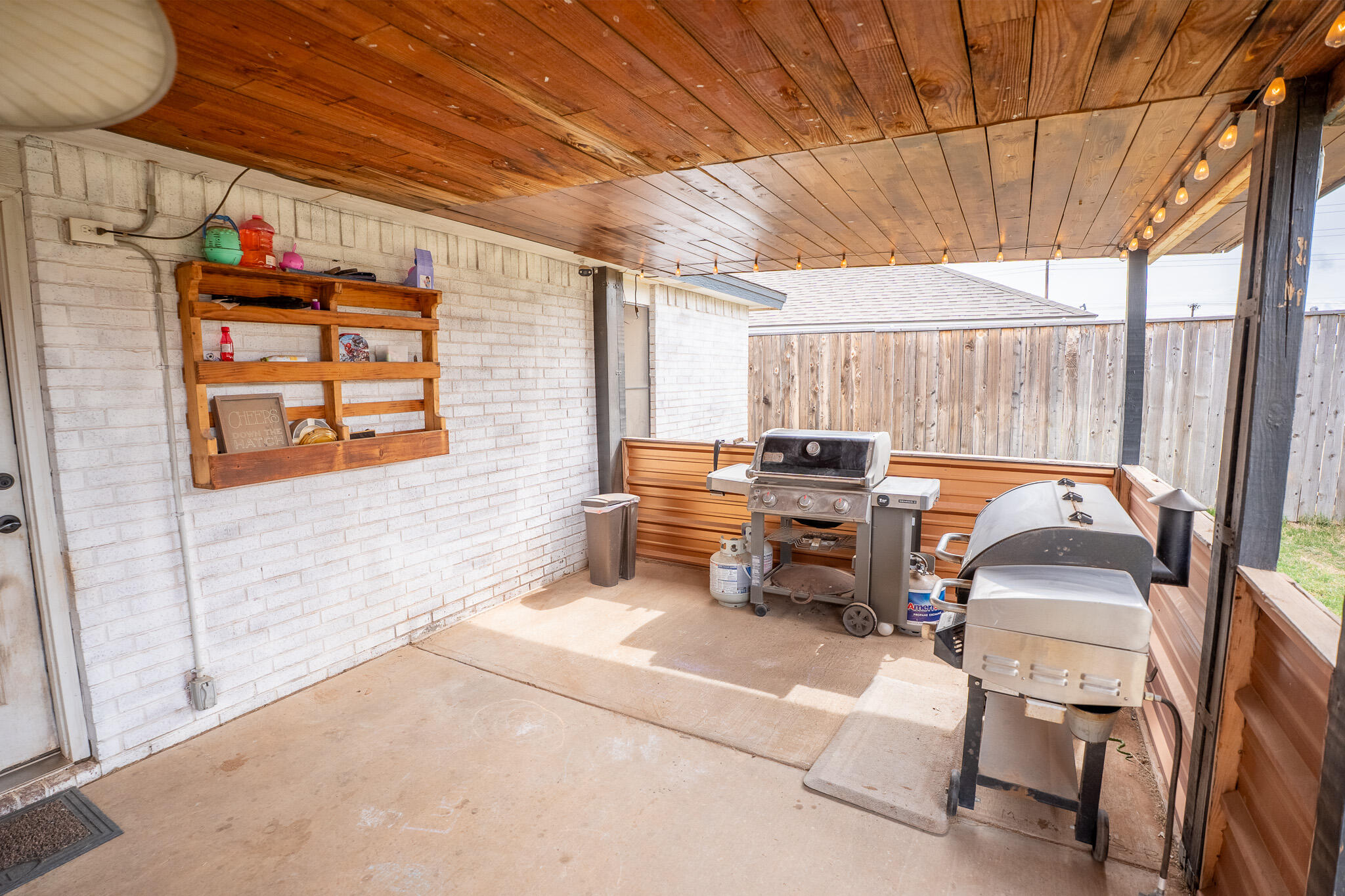 1609 78th Street Lubbock, TX 79423 - Photo 31 of 36 a backyard of a house with seating space