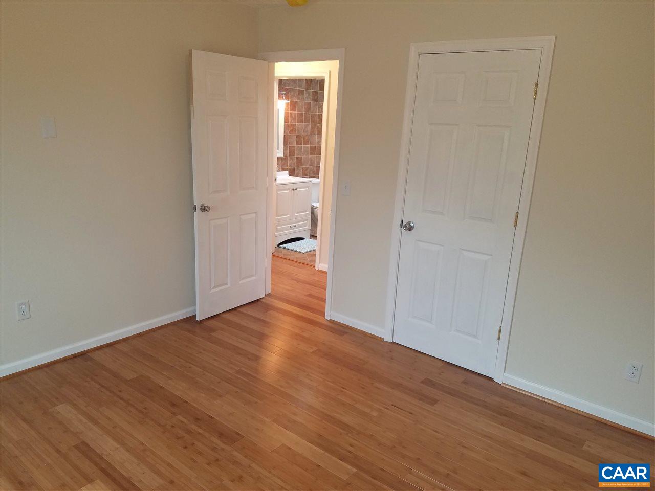 19 Holmes Run Road Stanardsville, VA 22973 - Photo 11 of 19 a view of a room with wooden floor and bathroom view