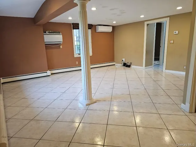 a view of an empty room and a window