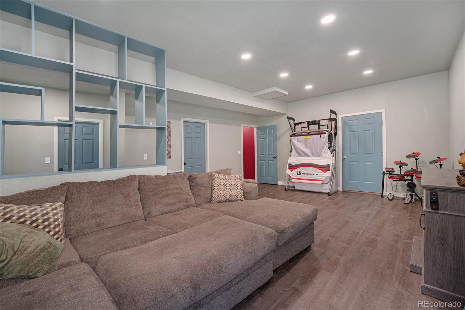21795 Indian Springs Road Conifer, CO 80433 - Photo 21 of 29 a living room with furniture and a flat screen tv