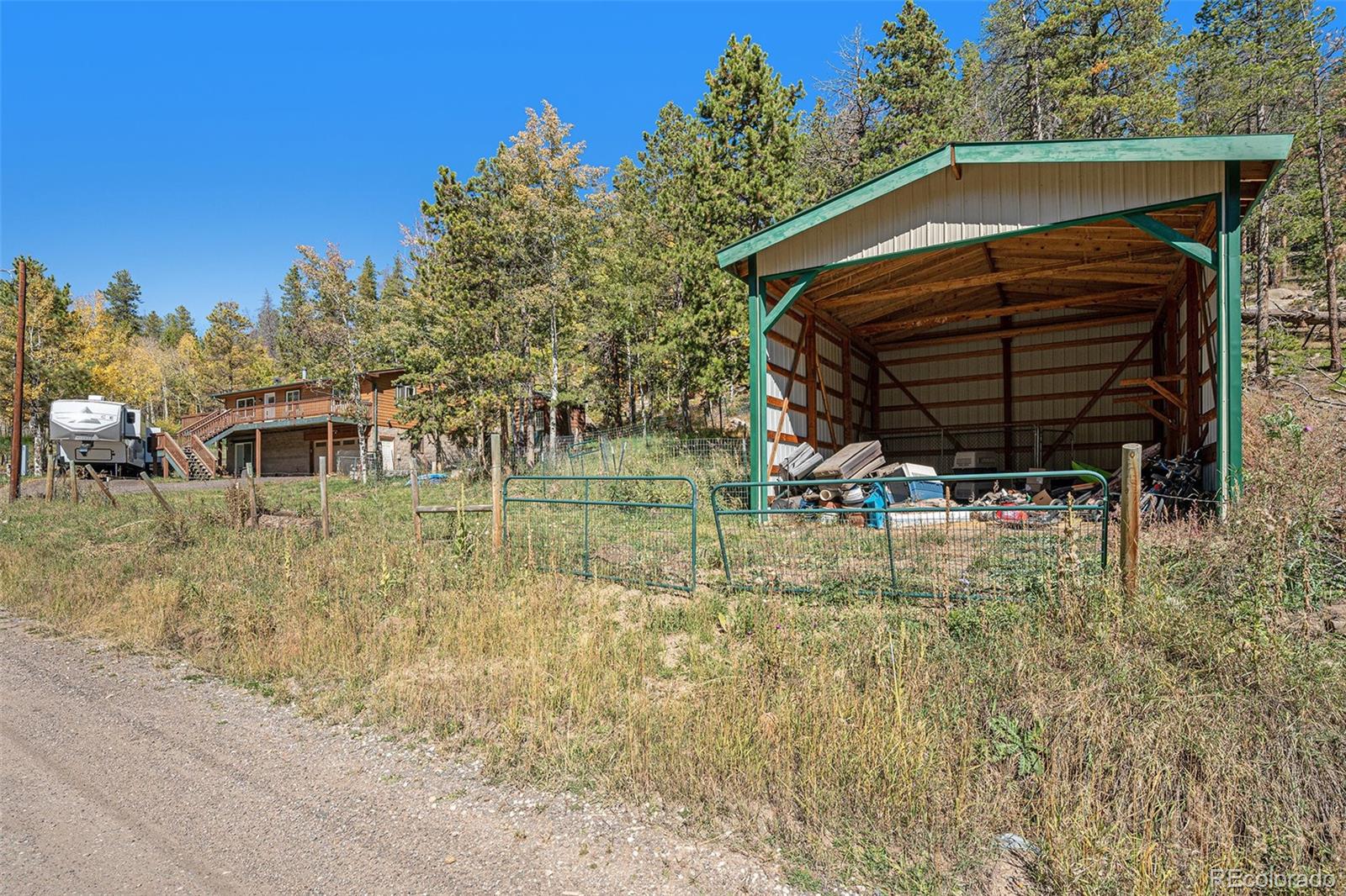 21795 Indian Springs Road Conifer, CO 80433 - Photo 24 of 29 a view of back yard of the house