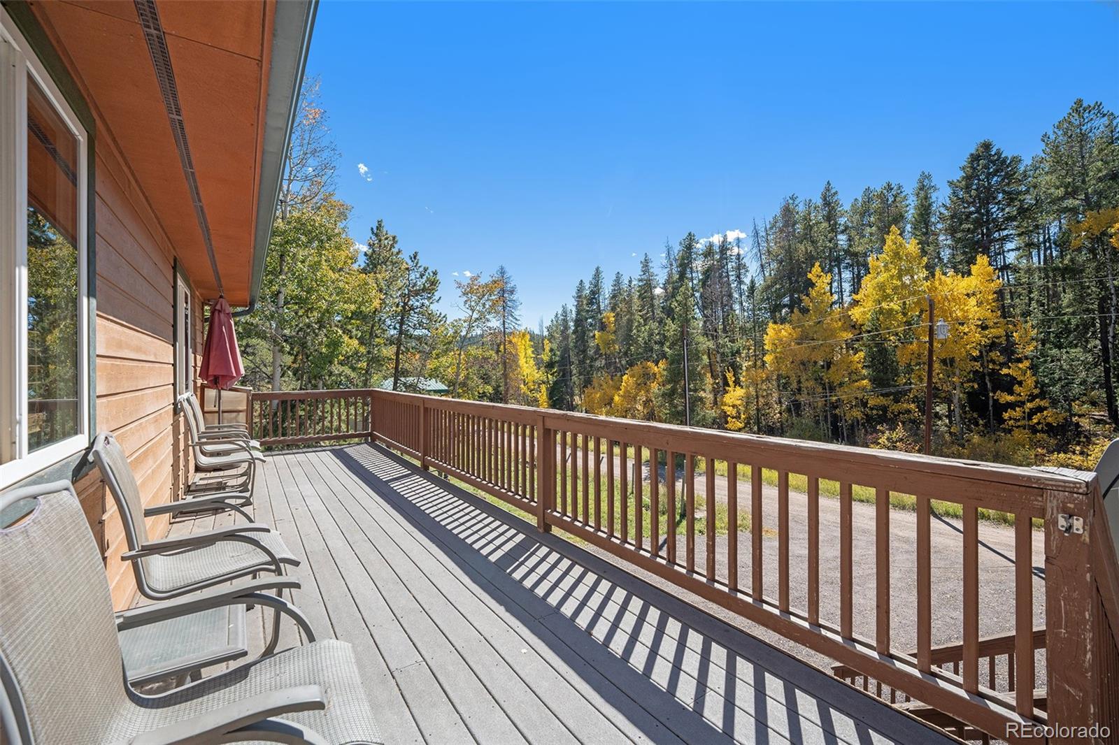 21795 Indian Springs Road Conifer, CO 80433 - Photo 25 of 29 a view of balcony with furniture