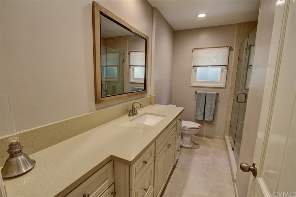 12419 Honolulu Terrace Whittier, CA 90601 - Photo 19 of 59 a bathroom with a sink and a toilet