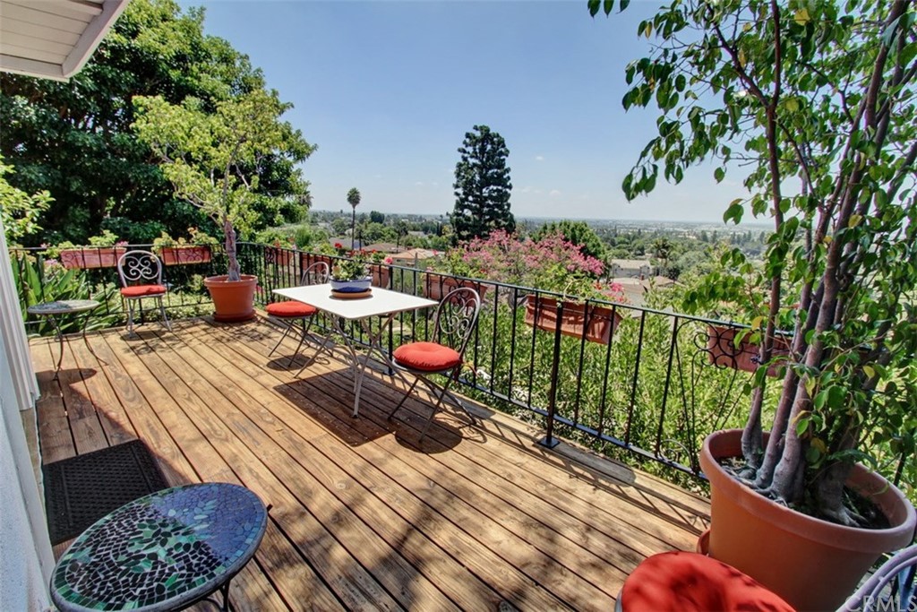 12419 Honolulu Terrace Whittier, CA 90601 - Photo 26 of 59 a view of a balcony with chairs and a potted plant