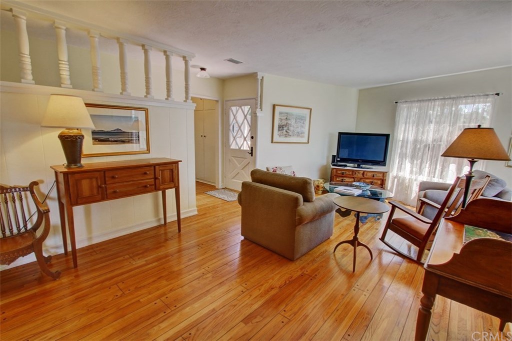 12419 Honolulu Terrace Whittier, CA 90601 - Photo 4 of 59 a living room with furniture a fireplace and a flat screen tv