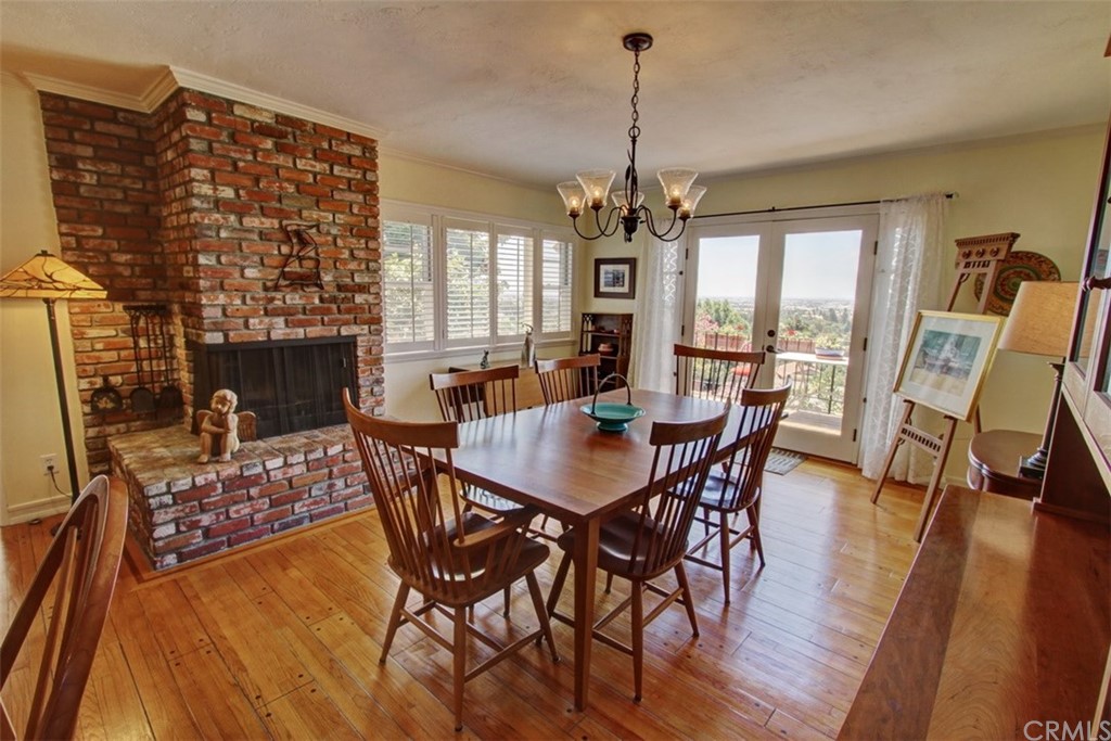 12419 Honolulu Terrace Whittier, CA 90601 - Photo 8 of 59 a view of a dining room with furniture window and wooden floor